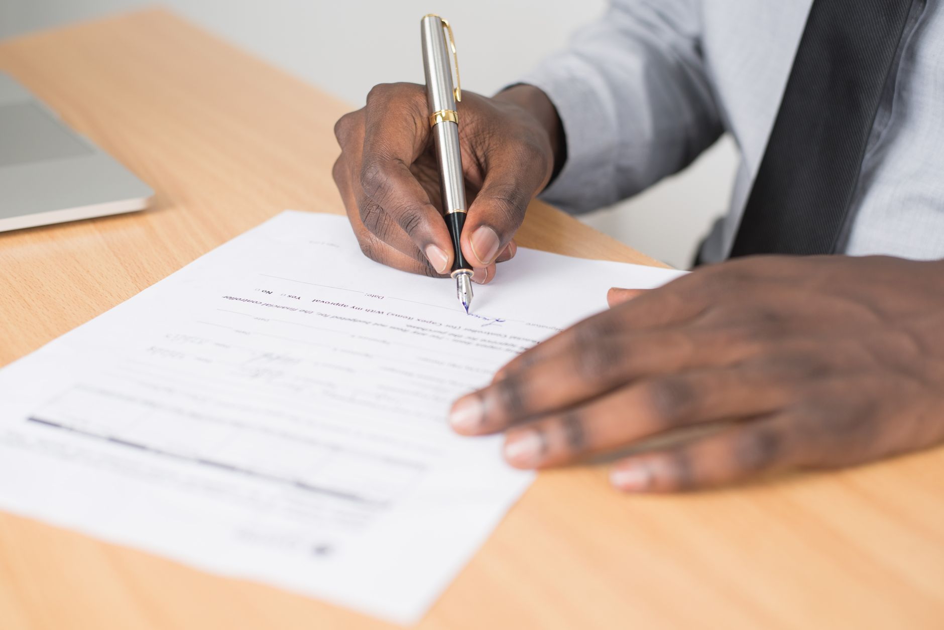 Paperwork being signed at a desk